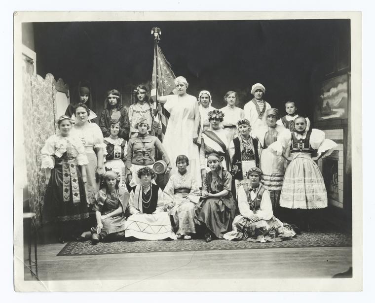 Group of women, each in traditional ancestral costume.jpg